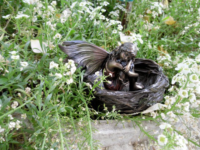 TINY FAIRY SLEEPING IN BIRD NEST Garden Sculpture