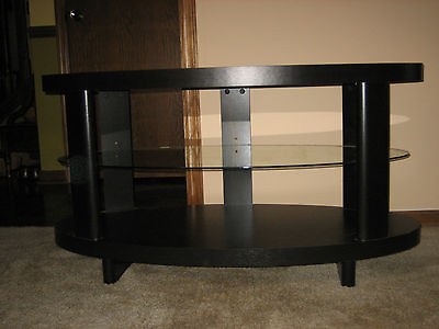   TV STAND. STORAGE SHLVS. BLACK W/ GLASS CTR. SHELF.LOCAL PICKUP