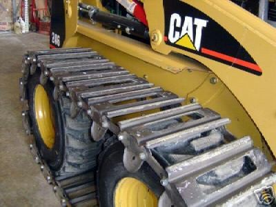 skidsteer over the tire tracks in Parts & Parts Machines