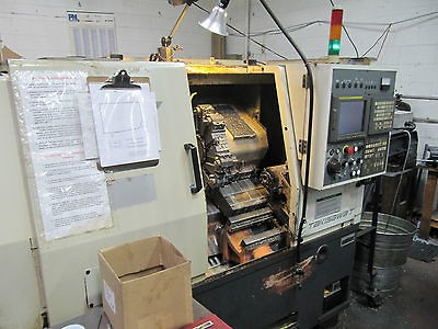 TAKISAWA MODEL EX106 2 AXIS TURNING CENTER NEW   1999