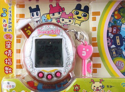 BANDAI TAMAGOTCHI V5 WITH DVD FAMITAMA CHINA VERSION   BROWN