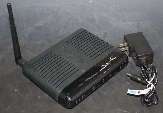 Up for auction we have a used Qwest Actiontec DSL Wireless Router, M/N 