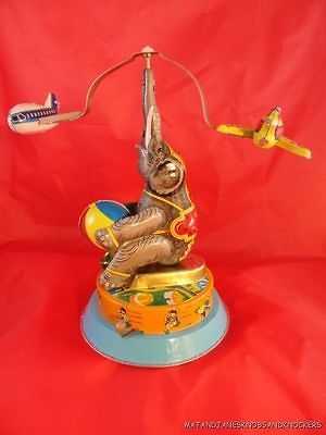   VINTAGE STYLE TINPLATE ELEPHANT BALANCES AEROPLANES CLOCKWORK TIN TOY