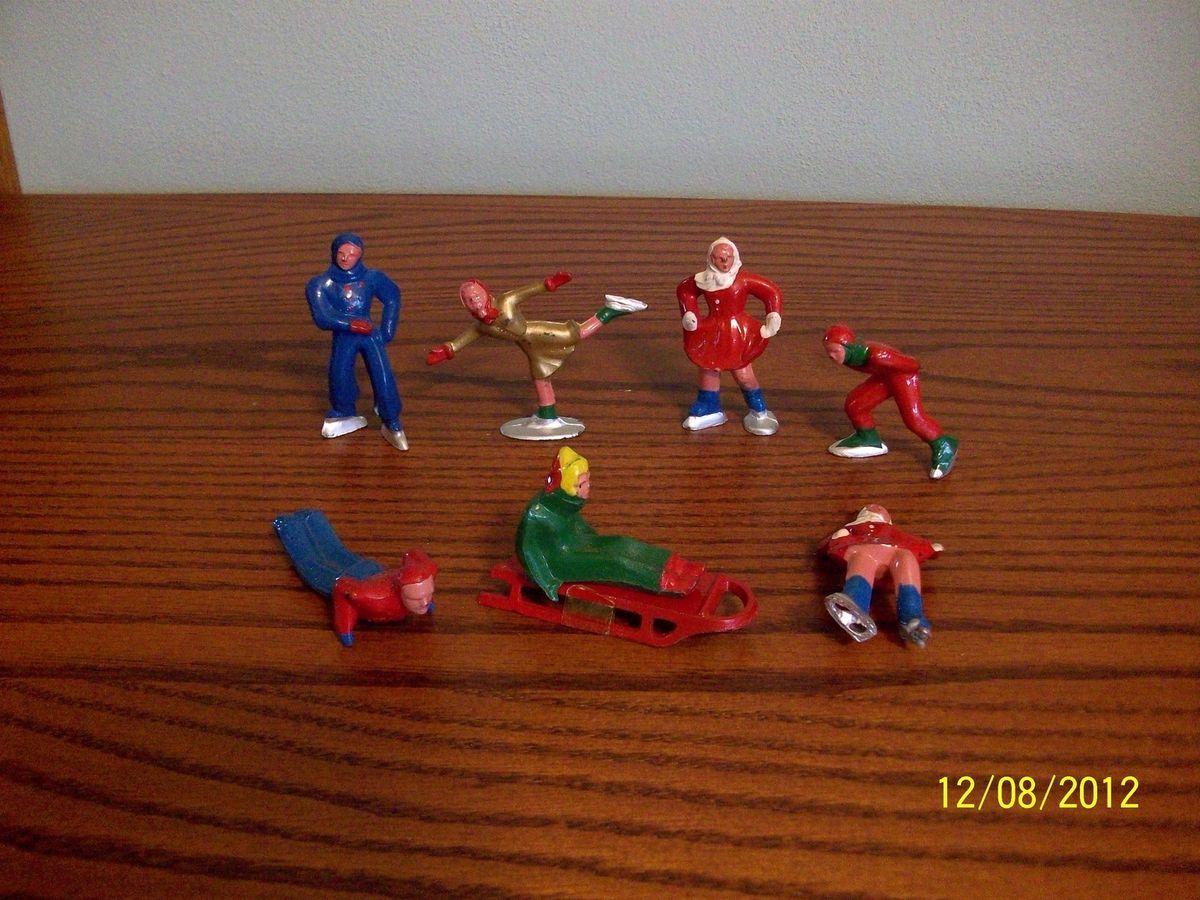 Vintage Lead Skaters and Sledders Holiday Figurines