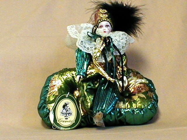 Geppeddo Jester Porcelain Doll Green Gold on Pillow