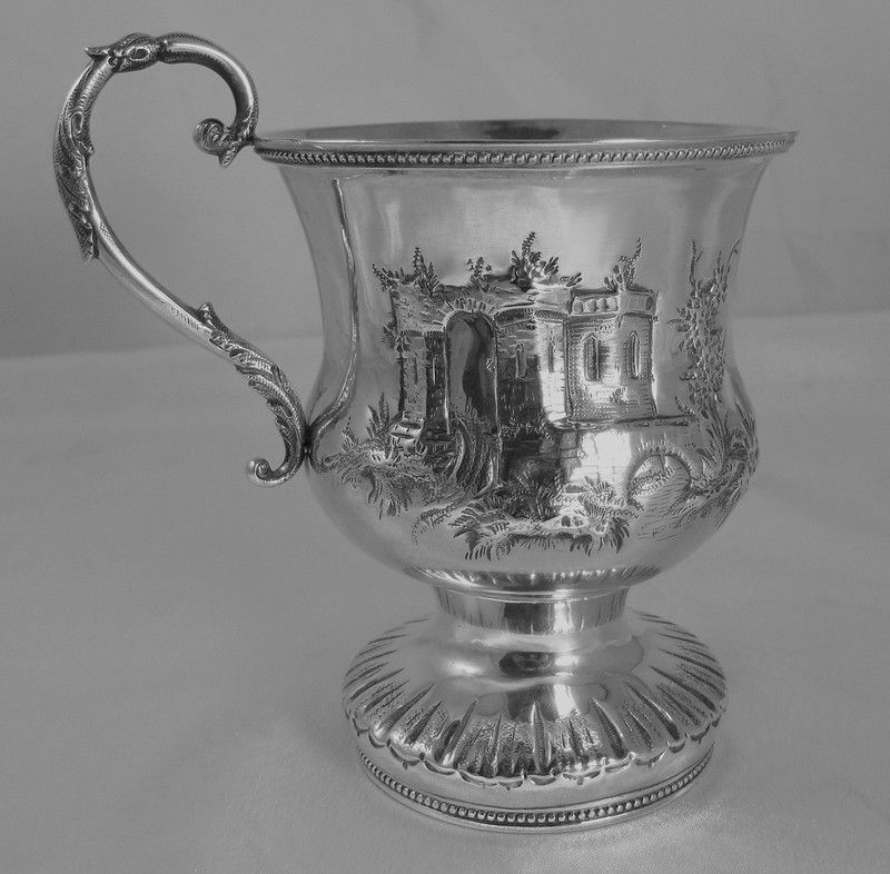  REPOUSSE FOOTED CUP CREATED BY THE FIRM OF GOULD, STOWELL, & WARD