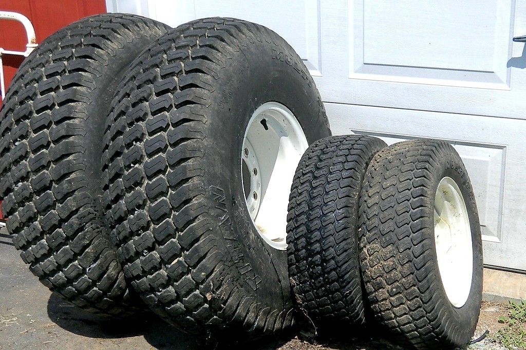  TITAN MULTI TRAC TURF TIRES ON FORD NEW HOLLAND 1725 TRACTOR WHEELS